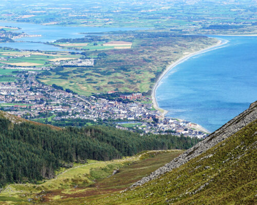 Newcastle from The Mourne Mountains. Newcastle is seaside resort town in County Down, Northern Ireland